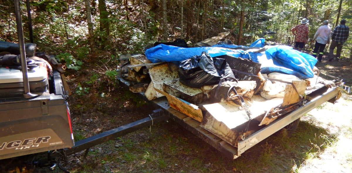 photo of cut up boat parts on trailer